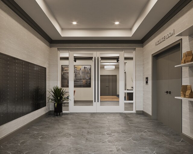 hall featuring mail boxes and a tray ceiling