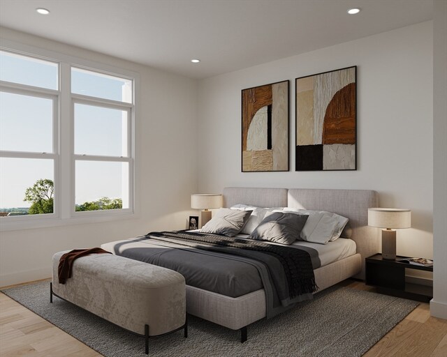 bedroom featuring light hardwood / wood-style floors and multiple windows