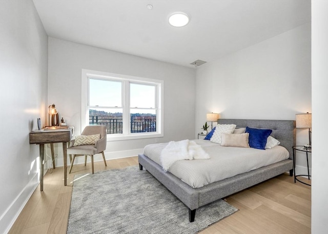 bedroom with light hardwood / wood-style flooring