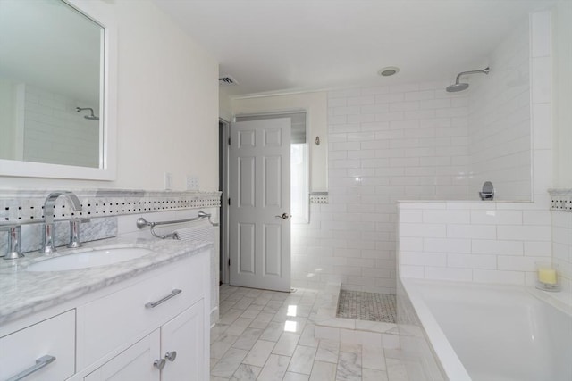 full bathroom with a bathing tub, tile walls, a tile shower, and vanity
