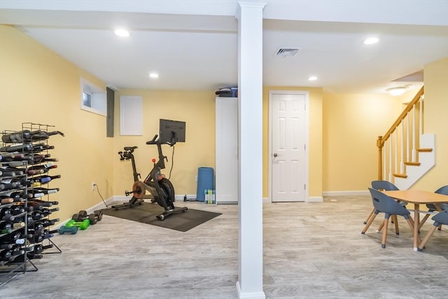 workout room with baseboards, recessed lighting, wood finished floors, and visible vents