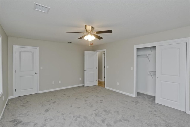 unfurnished bedroom featuring ceiling fan and light colored carpet