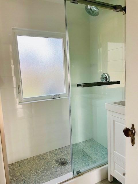 full bathroom with a stall shower