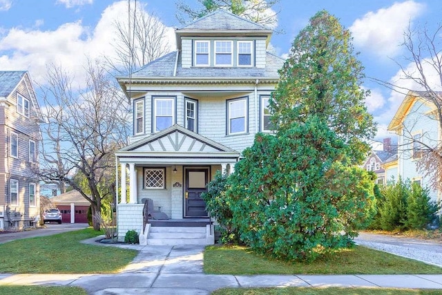 victorian-style house featuring a front yard