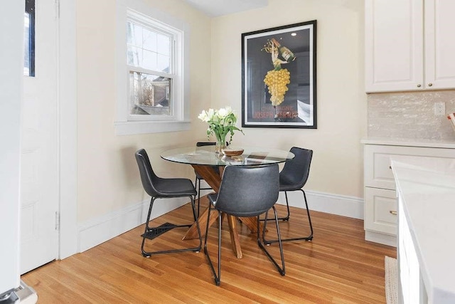 dining space with light wood-type flooring