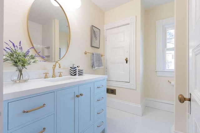 bathroom featuring tile patterned floors and vanity