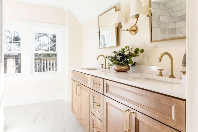 bathroom featuring vanity and lofted ceiling