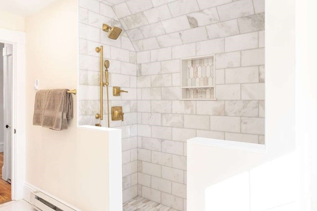 bathroom with a tile shower