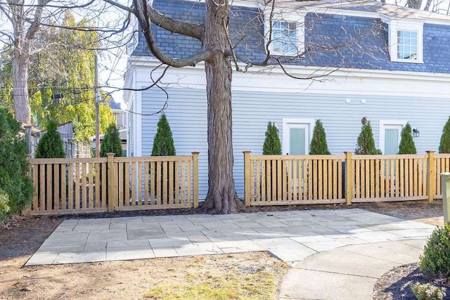 view of side of property with a patio