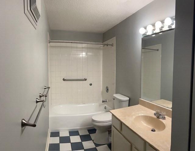 3 Village Rock Ln Unit 1, Natick, MA 01760 - bathroom with toilet, tile patterned floors, shower / tub combination, vanity, and a textured ceiling
