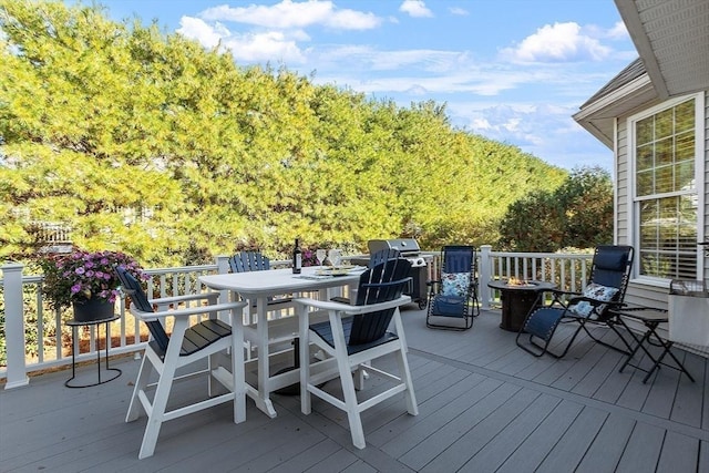 wooden terrace featuring area for grilling