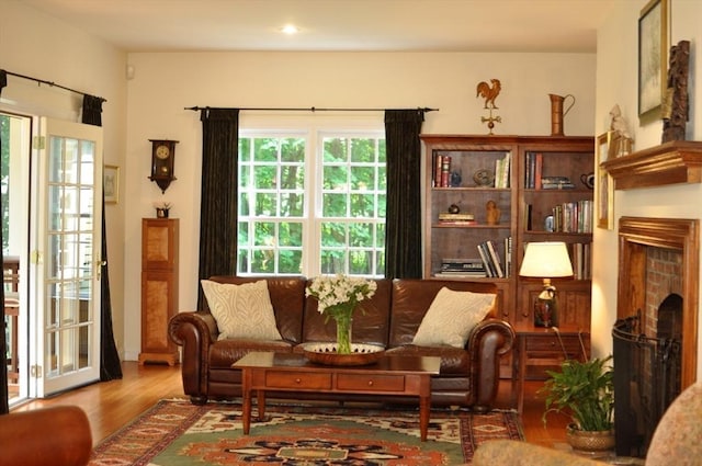 living room featuring wood finished floors and a fireplace