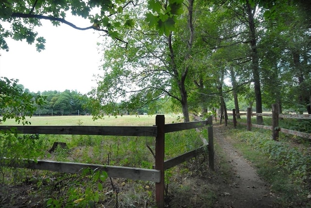 view of gate featuring fence