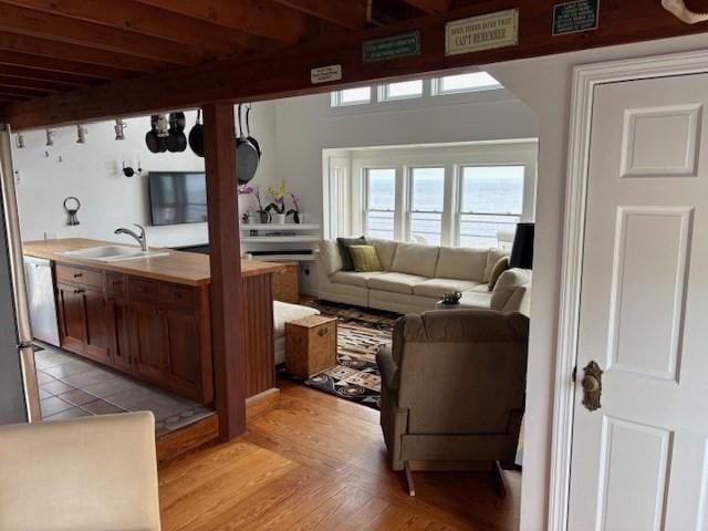 7 Cove St, Mattapoisett, MA 02739 - living area with beam ceiling and light wood finished floors