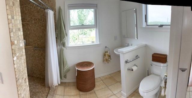 7 Cove St, Mattapoisett, MA 02739 - bathroom with tiled shower and tile patterned flooring