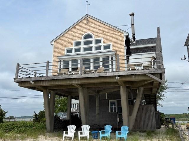 7 Cove St, Mattapoisett, MA 02739 - rear view of house with a balcony