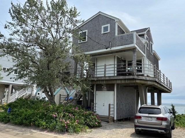 7 Cove St, Mattapoisett, MA 02739 - view of front of house with a balcony