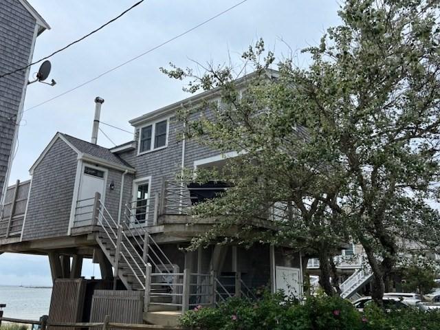 7 Cove St, Mattapoisett, MA 02739 - view of front of property featuring stairway and a deck with water view