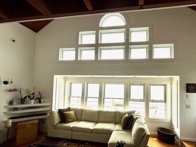 7 Cove St, Mattapoisett, MA 02739 - living area with beamed ceiling, high vaulted ceiling, and wood finished floors