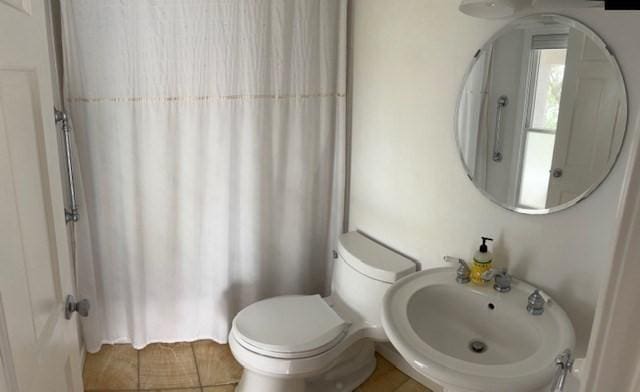 7 Cove St, Mattapoisett, MA 02739 - full bath with a shower with shower curtain and tile patterned floors