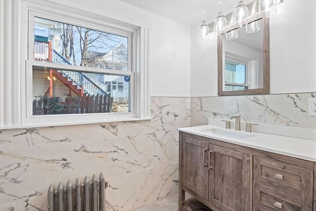 bathroom featuring vanity and radiator heating unit