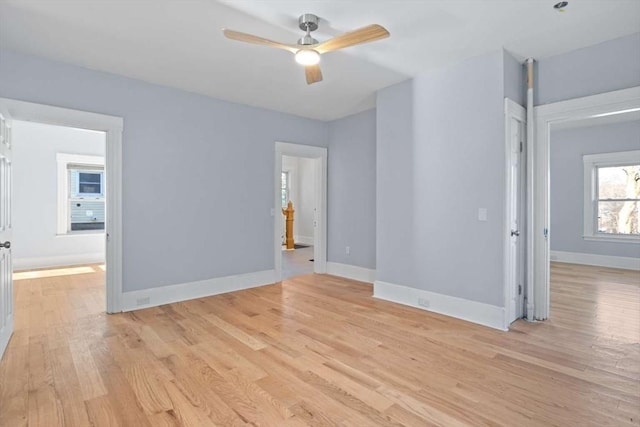 unfurnished room featuring light hardwood / wood-style floors and ceiling fan