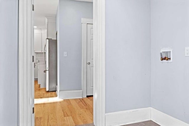 corridor featuring light hardwood / wood-style flooring