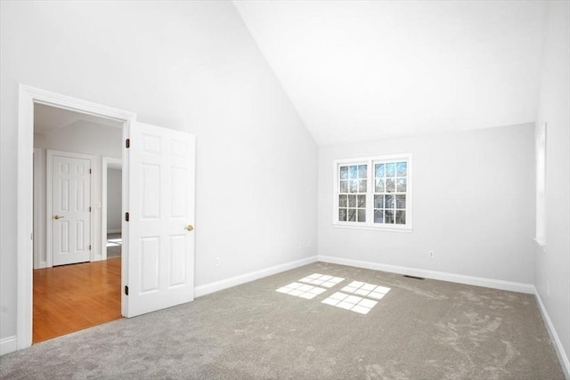 bonus room with vaulted ceiling, baseboards, and carpet floors