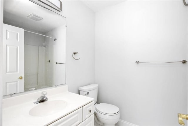 full bath featuring visible vents, a shower, toilet, and vanity