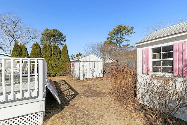 view of yard with a storage shed and an outdoor structure