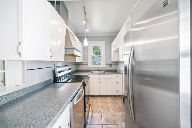 kitchen featuring backsplash, custom range hood, appliances with stainless steel finishes, tile patterned flooring, and white cabinetry