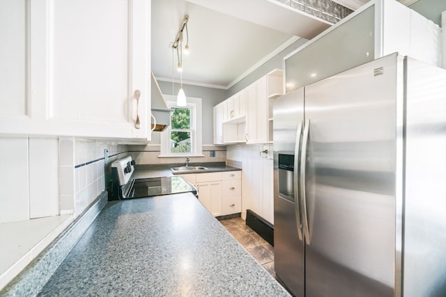 kitchen featuring high quality fridge, tasteful backsplash, sink, stove, and dark tile patterned floors