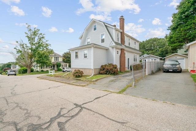 view of side of property with a garage