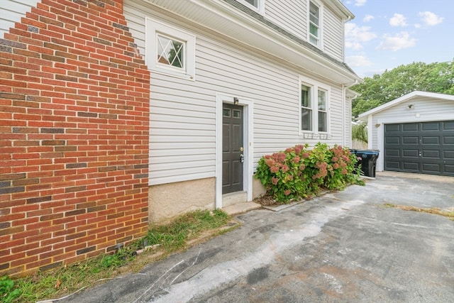 view of side of property with an outbuilding and a garage