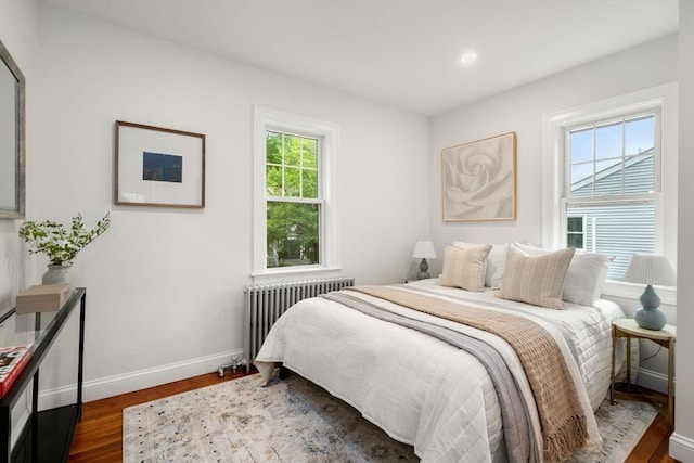 22 Carter St, Newton, MA 02460 - bedroom featuring radiator, baseboards, and dark wood-style flooring