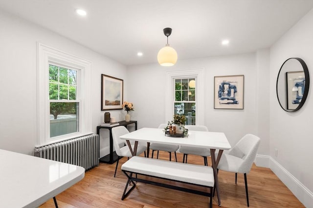 22 Carter St, Newton, MA 02460 - dining space with radiator heating unit, plenty of natural light, light wood-style floors, recessed lighting, and baseboards
