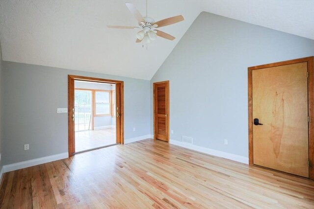 47 Forest St, Franklin, MA 02038 - empty room featuring ceiling fan, high vaulted ceiling, baseboards, and light wood-style flooring