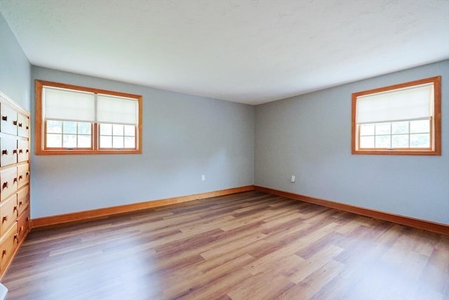 47 Forest St, Franklin, MA 02038 - spare room with light wood-style floors and baseboards