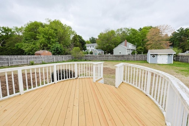 47 Forest St, Franklin, MA 02038 - wooden terrace with a shed, an outdoor structure, and view of wooded area