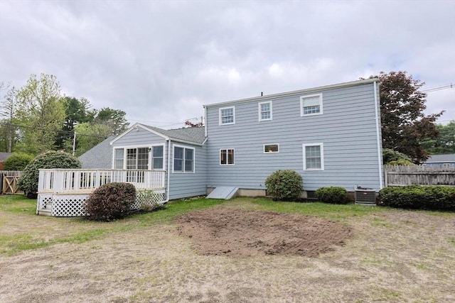 47 Forest St, Franklin, MA 02038 - back of house featuring a wooden deck, cooling unit, and fence
