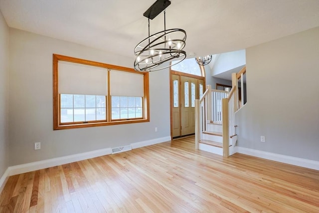 47 Forest St, Franklin, MA 02038 - unfurnished room featuring a chandelier, wood finished floors, and baseboards