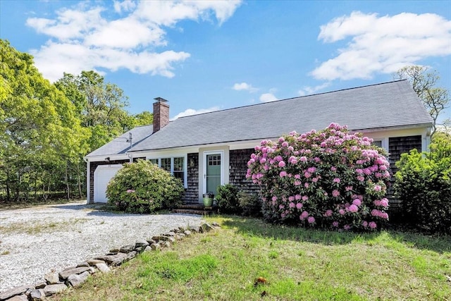 274 Morton Rd, Chatham, MA 02659 - view of front of property featuring a garage, driveway, a chimney, and a front yard