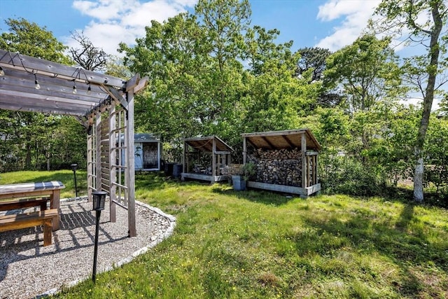 274 Morton Rd, Chatham, MA 02659 - view of grassy yard featuring an outdoor structure and a pergola