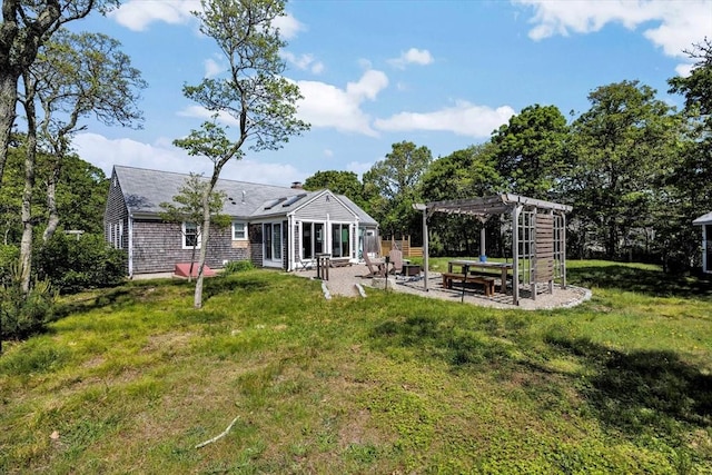 274 Morton Rd, Chatham, MA 02659 - rear view of property featuring a pergola, a patio, and a lawn