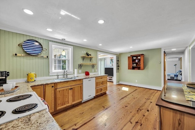 274 Morton Rd, Chatham, MA 02659 - kitchen with white dishwasher, a sink, baseboards, light wood-style flooring, and recessed lighting
