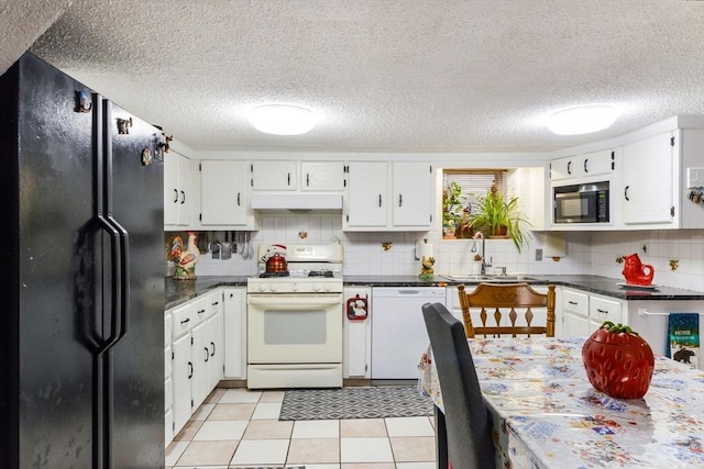 kitchen featuring white appliances, sink, and white cabinets