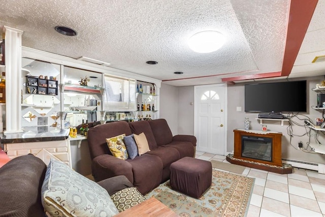 tiled living room with a baseboard radiator and a textured ceiling