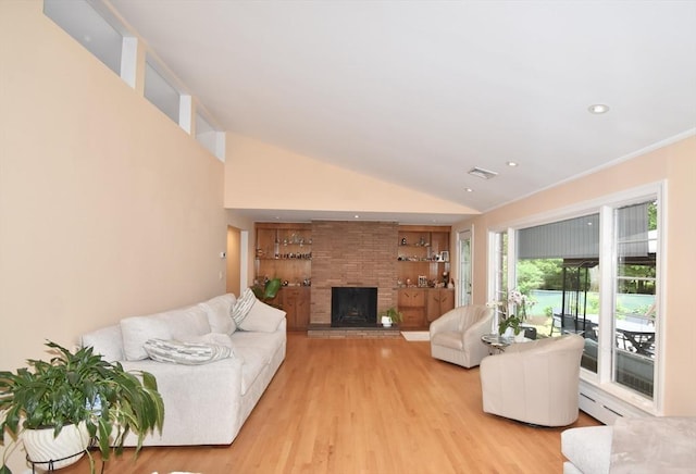 166 Primrose Dr, Longmeadow, MA 01106 - living area with built in features, light wood-type flooring, a fireplace, vaulted ceiling, and recessed lighting