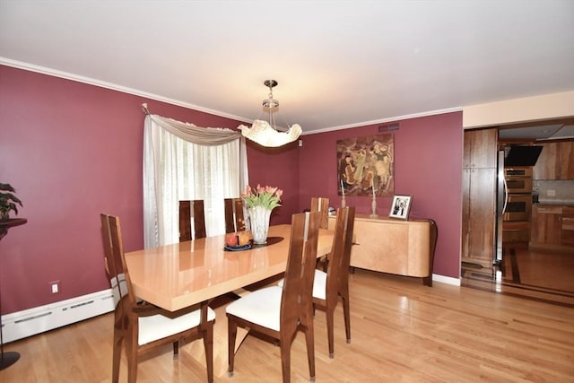 166 Primrose Dr, Longmeadow, MA 01106 - dining space featuring a chandelier, baseboard heating, light wood-style flooring, baseboards, and ornamental molding
