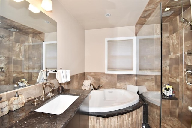 166 Primrose Dr, Longmeadow, MA 01106 - full bathroom with a bath, a shower stall, vanity, and tile walls